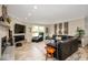 Comfortable living room featuring a fireplace, large window, and cozy seating at 3000 E County Road 400 N, Muncie, IN 47303