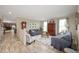 Comfortable living room featuring neutral tones, wood floors, and plenty of natural light at 3000 E County Road 400 N, Muncie, IN 47303
