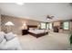 Spacious main bedroom suite featuring a dedicated desk area, ample natural light, and patterned wallpaper at 3000 E County Road 400 N, Muncie, IN 47303