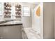 Bathroom features a neutral color scheme, modern fixtures, and decorative shelving at 3047 N New Jersey St, Indianapolis, IN 46205