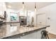 Bright kitchen with a spacious island, stainless steel appliances, and hanging pendant lights at 3047 N New Jersey St, Indianapolis, IN 46205