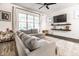 Cozy living room with a plush gray sectional sofa, large windows, and modern decor at 3047 N New Jersey St, Indianapolis, IN 46205