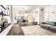 Open-concept living and dining area featuring modern furnishings and an adjacent kitchen at 3047 N New Jersey St, Indianapolis, IN 46205