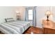 This bedroom features modern decor, wood floors, and neutral paint at 3348 Fox Orchard Cir, Indianapolis, IN 46214