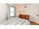 This bedroom features modern decor, wood floors, and neutral paint at 3348 Fox Orchard Cir, Indianapolis, IN 46214