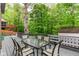 Grey painted outdoor deck with table and chairs at 3348 Fox Orchard Cir, Indianapolis, IN 46214