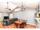 Open concept area with a dining table, chandelier, and view into the living room with a sofa at 3348 Fox Orchard Cir, Indianapolis, IN 46214