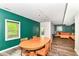 Inviting dining room features an wood table, with a bright window, and views to the living room space at 3348 Fox Orchard Cir, Indianapolis, IN 46214