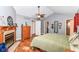 Spacious main bedroom with hardwood floors, a fireplace, and walk-in closet, perfect for relaxing at 3348 Fox Orchard Cir, Indianapolis, IN 46214