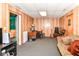 Finished basement music room/office with a guitar, keyboard, sound equipment, wood paneling and a comfortable sofa at 3348 Fox Orchard Cir, Indianapolis, IN 46214