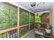 Relax on this screened in porch with views of mature trees and the backyard at 3348 Fox Orchard Cir, Indianapolis, IN 46214