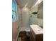 Compact bathroom with a shower, vanity, and window at 3541 Alpine Pl, Indianapolis, IN 46226