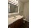 Bathroom with a vanity, toilet, and a mirror reflecting the shower and tub at 3541 Alpine Pl, Indianapolis, IN 46226