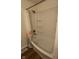 Bathroom featuring a shower-tub combination, accented by a floral curtain at 3541 Alpine Pl, Indianapolis, IN 46226