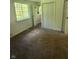 Carpeted bedroom with view from the window to the trees outside at 3541 Alpine Pl, Indianapolis, IN 46226
