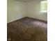 Sunlit bedroom offers a cozy space with clean walls and plush carpeting at 3541 Alpine Pl, Indianapolis, IN 46226