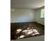 Bright bedroom with natural light features a large window, hardwood flooring, and freshly painted walls at 3541 Alpine Pl, Indianapolis, IN 46226