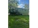 Home exterior with a backyard deck at 3541 Alpine Pl, Indianapolis, IN 46226