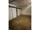 Spacious two-car garage with white doors and concrete flooring at 3541 Alpine Pl, Indianapolis, IN 46226
