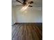 Spacious living room has a ceiling fan and hardwood floors at 3541 Alpine Pl, Indianapolis, IN 46226