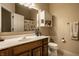 Cozy bathroom featuring a single sink vanity, toilet, and shower, providing essential amenities at 3556 Towne Dr, Carmel, IN 46032
