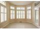 Sun-drenched breakfast nook featuring large windows, tile flooring, and a patio door entrance at 3556 Towne Dr, Carmel, IN 46032