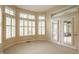 Bright breakfast nook with large windows and shutters, adjacent to a patio with double doors at 3556 Towne Dr, Carmel, IN 46032