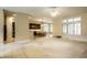 Open-concept dining room and living room with large windows and neutral palette at 3556 Towne Dr, Carmel, IN 46032
