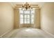 Large dining area featuring neutral walls, bay window, and elegant chandelier at 3556 Towne Dr, Carmel, IN 46032