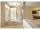 Open foyer featuring tile floors and views to the dining and kitchen areas at 3556 Towne Dr, Carmel, IN 46032
