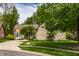 Lovely brick home with well-maintained landscaping and a large driveway at 3556 Towne Dr, Carmel, IN 46032