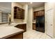 Well-equipped kitchen with stainless steel appliances, dark wood cabinets, and ample counter space at 3556 Towne Dr, Carmel, IN 46032
