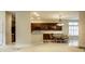 Open-concept kitchen and dining area featuring dark wood cabinetry and a chandelier at 3556 Towne Dr, Carmel, IN 46032