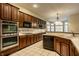 Traditional kitchen featuring stainless appliances, wooden cabinets, and a breakfast nook with abundant light at 3556 Towne Dr, Carmel, IN 46032