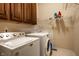 Well-equipped laundry room with modern washer and dryer, plus ample cabinetry and shelving at 3556 Towne Dr, Carmel, IN 46032