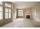 Spacious living room featuring large windows, fireplace, and carpet flooring ready for customization at 3556 Towne Dr, Carmel, IN 46032