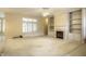 Bright living room featuring a fireplace with built-in shelving and large windows at 3556 Towne Dr, Carmel, IN 46032