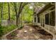Enclosed patio and view of a lush backyard with mature trees at 3556 Towne Dr, Carmel, IN 46032