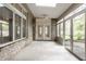 Spacious sunroom featuring a skylight, brick accents, and multiple windows offering outdoor views at 3556 Towne Dr, Carmel, IN 46032