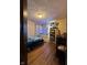 Cozy bedroom with wood floors and traditional dresser and mirror at 3646 Creston Dr, Indianapolis, IN 46222