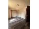 Bedroom with dark wood-look floors and closet at 3646 Creston Dr, Indianapolis, IN 46222