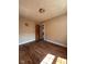 Bedroom with hardwood floors and view of entry to adjacent room at 3646 Creston Dr, Indianapolis, IN 46222