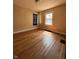 Bedroom featuring hardwood floors, natural light, and a neutral color palette at 3646 Creston Dr, Indianapolis, IN 46222