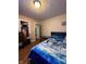 Bright bedroom with hardwood floors, closet and view to the hall at 3646 Creston Dr, Indianapolis, IN 46222