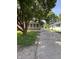 View of a single story home featuring a brick facade, green siding, and a long driveway at 3646 Creston Dr, Indianapolis, IN 46222