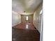 Spacious living room featuring hardwood flooring, neutral paint, and ample natural light from the window at 3646 Creston Dr, Indianapolis, IN 46222