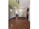 Inviting living room showcasing hardwood flooring, fresh neutral paint, and views of the kitchen at 3646 Creston Dr, Indianapolis, IN 46222