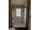 Bathroom features a glass enclosed shower with tile walls and a built in bench at 3646 Creston Dr, Indianapolis, IN 46222