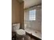 Tiled shower with glass doors and a built-in seat at 3646 Creston Dr, Indianapolis, IN 46222
