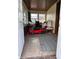 Inviting sunroom with tiled floor featuring multiple windows, and a red toy car at 3646 Creston Dr, Indianapolis, IN 46222